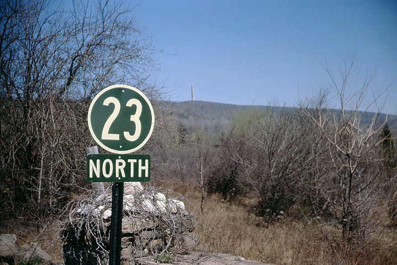 High Point, New Jersey. <br><br>
<i>This is my only photo of a standard New Jersey shield of that era. The state route shields AND the US Route shields were all dark green with white lettering (just the number in the shield, no “NJ” or “US”). They were superseded by the standard black-and-white circles, starting in the mid-1960s.</i>