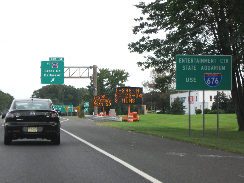 Guide sign letting motorists know who wish to visit the state aquarium and entertainment center in nearby Camden to use the upcoming Interstate 676 freeway.
