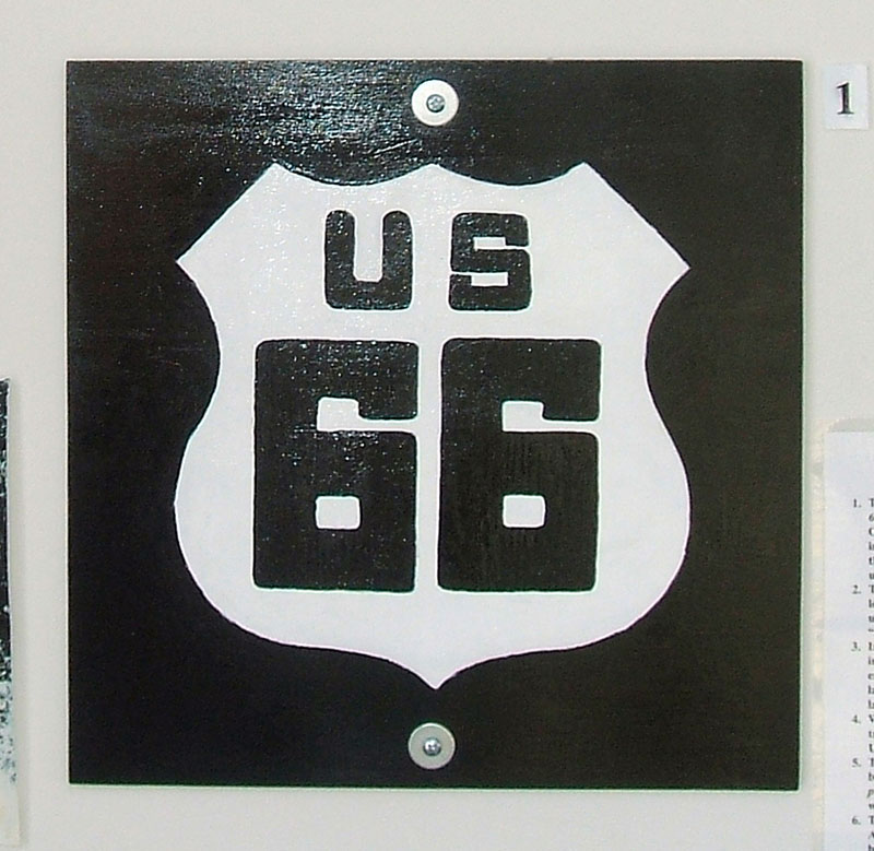 This marker was used to temporarily sign the route in the very beginning of the US highway system, before permanent metal signs were stamped out.