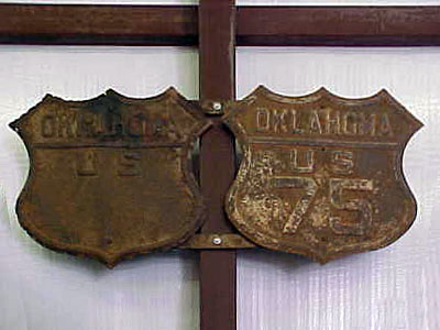 Original highway marker gantry.  The one on the left is a US-66.
