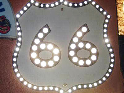 US-66 sign - either the genuine article, intended for green guide sign use, or a replica assembled from surplus parts. 24x24 inch size.