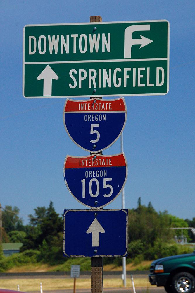 1961-spec (21x18) 5/105 gantry recycled for City of Eugene use. Note the old shields still visible on the backs of the redone signs.