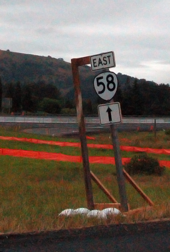 Cutout highway marker in a construction zone.