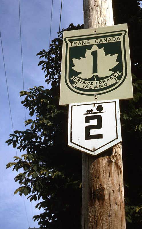 Charlottetown.  <br><br>

<i>Now this Prince Edward Island stuff is really interesting, looking back.  I was not really impressed with their road markings back in 1965.  The PEI route markers looked quite flimsy (especially when compared to the Trans-Canada highway sign).  They were made of wood and almost looked hand painted.  They were also sparsely placed and hard to follow beyond the main routes.  The symbol above the numeral “2” is a line of trees, part of the PEI provincial flag.</i>