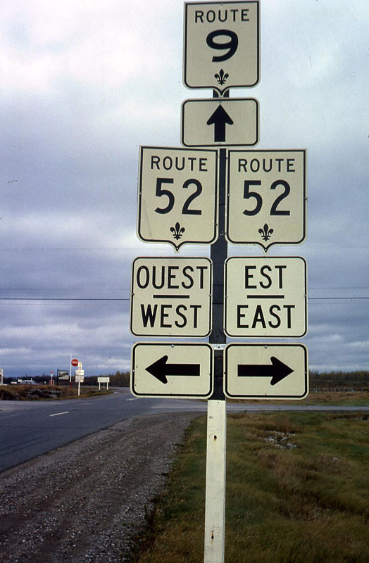 Lacolle. <br><br>
<i>I think this may be your first Quebec photo, but that Canadian province wasn’t that far from Troy, NY, and I managed to get up there once during my time there. This was before the total revamp of their numbering system, which introduced Autoroutes and the green fleur-de-lis signs. I’ve seen an older version of these signs on E-bay from time to time.</i>