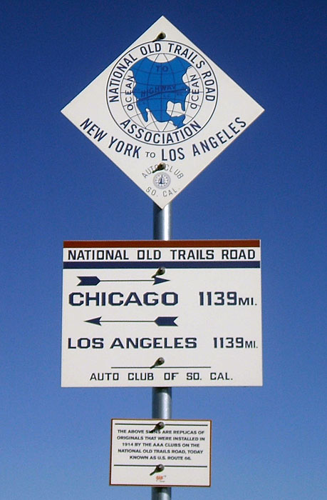 Replicas of 1910s guide signs on old US-66 in Adrian.