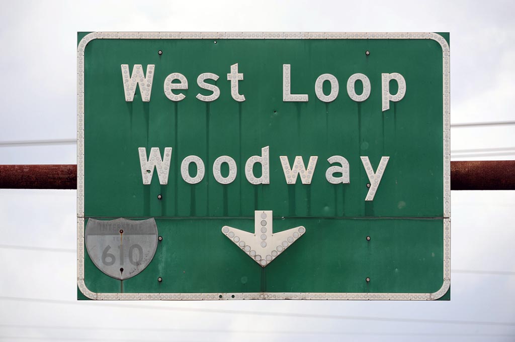 1950s highway marker on a 1960s green guide sign.