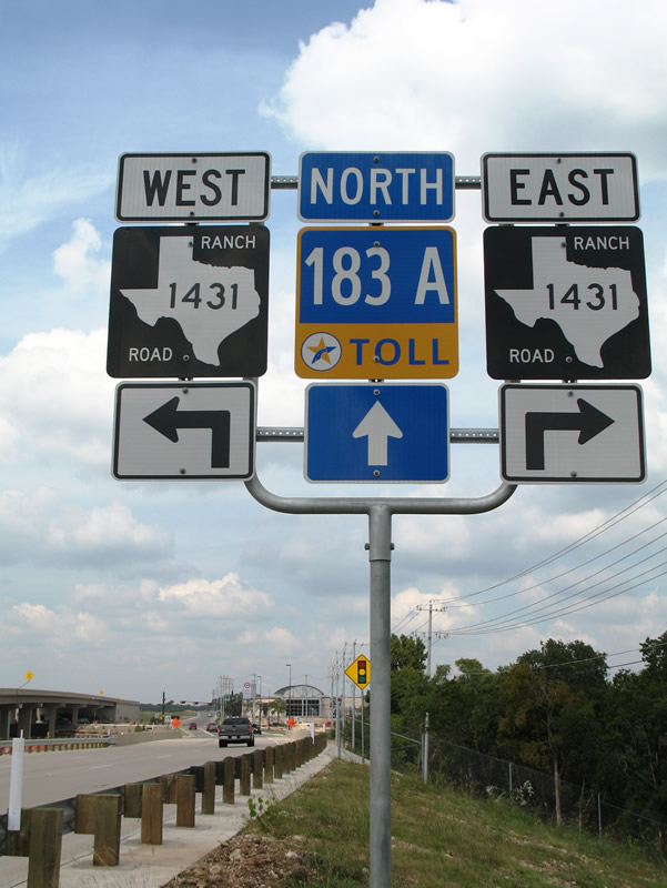 Texas TOll 183A and FM 1431 shield assembly posted on the northbound off-ramp to Cedar Park and Round Rock.