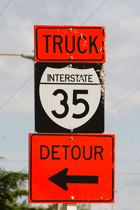 The construction zone being bypassed is long complete, but several examples of this City of Laredo-installed sign remain.