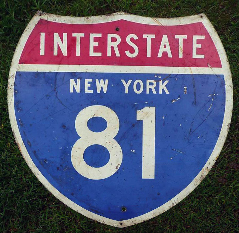This sign, made to 1957 specification as an I-81 shield by the state of New York, was reused to create an interstate 89 trailblazer across the border to Vermont.