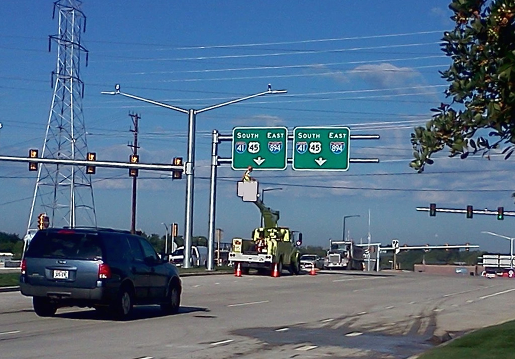 Guide signs being installed showing the future Interstate 41 designation.