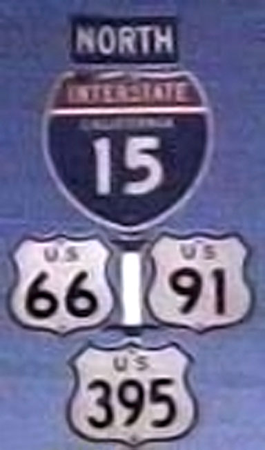 California - U.S. Highway 395, U.S. Highway 91, U.S. Highway 66, and Interstate 15 sign.