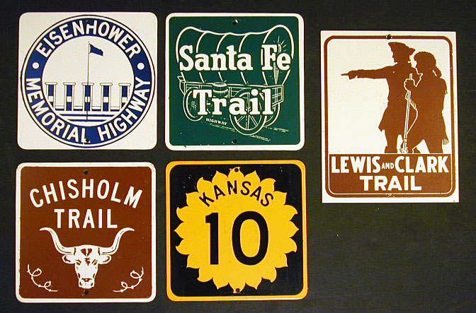 Kansas - state highway 10, Santa Fe Trail, Chisholm Trail, Eisenhower Memorial Highway, and Lewis and Clark Trail sign.