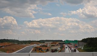 Passing over SR 1/7 and looking south from Interstate 95 northbound, with the supports for the eventual flyover connecting I-95 south with SR 1 south in view. 06/03/12