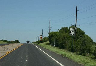 Advance signage for FM 2602. FM 2602 connects SH 6 and FM 217 near Mosheim. We are approaching Clifton at this point.