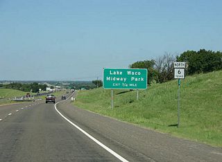 Advance signage for Lake Waco Midway Park. This is the first of four exits from SH 6 that serve Lake Waco.