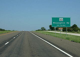 The final exit on the SH 6 freeway serves Spur 412, McLaughlin Road.