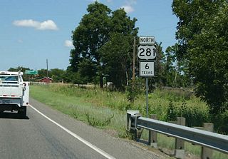 This overlap sign features the route numbers stacked vertically. SH 6/US 281 is about to enter Erath County.