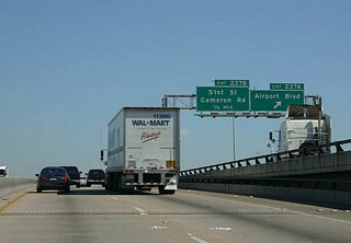 Exit 237 A also departs from the IH 35 upper deck to Airport Boulevard just ahead of the merge with the lower roadway.