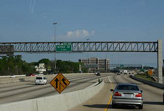 Merging onto IH 45 north from Beltway 8, travelers head one mile to Exit 63 with Airtex Drive.