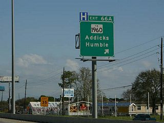 Exit 66A is a three level interchange, with the main lanes of FM 1960 depressed under the feeder roads, and IH 45 crossing over the top of both. Exit 66A also serves the Spring Park and Ride. There are several Park and Rides facilities along the North Freeway with direct connections to the Express lane.