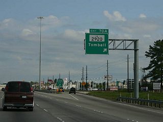 FM 2920 runs west from IH 45 to the city of Tomball. Tomball was previously a small farm town that grew rapidly as the ring of Houston suburbs pushed further north through Harris County.