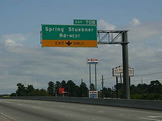 Exit 70B follows FM 2920 (Spring Cypress Road) for Spring Stuebner Road west in the community of Spring. The slip ramp to the North Freeway Service Road also leads motorists on IH 45 to the three level interchange with Grand Parkway (SH 99).