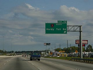The Hardy Toll Road merges onto IH 45 northbound directly at a wye interchange. Exit 72 utilizes the frontage road systems of both roadways to make the connection.