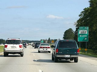 FM 1097 (Montgomery Street) meets IH 45 at the first of three exits for the city of Willis. FM 1097 arcs northeast from Willis to SH 150 through Sam Houston National Forest. West across Lake Conroe, FM 1097 continues to FM 149 at Montgomery.
