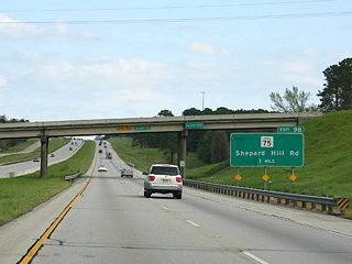 SH 75, the former alignment of U.S. 75, closely parallels IH 45 from Conroe to Streetman. Exit 98 joins SH 75 ahead of Shepard Hill Road west toward Lake Conroe.