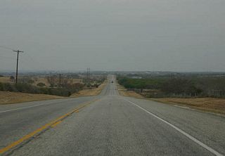 SH 72 crosses pasturelands, dotted by Live Oaks, on the way to Kenedy.