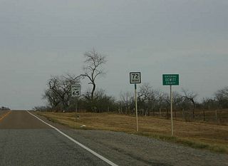 Leaving Nordheim, this view shows the characteristic flat terrain between Nordheim and Yorktown. SH 72 enters Dewitt County in this picture.