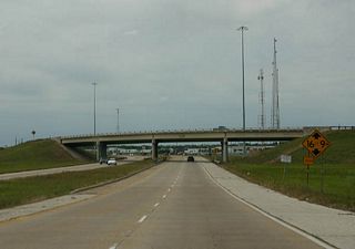 Curving west on Texas 288 ahead of the merge with Texas 332. Texas 288 Business totals 20.2 miles between Clute and a point north of Angleton.