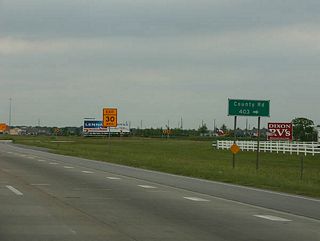 A right-hand turn facilitates the movement from Texas 288 north onto Brazoria County Route 403 (Hughes Ranch Road) east. Hughes Ranch Road serves a myriad of subdivisions between the freeway and Cullen Boulevard (Texas Urban Road 865).