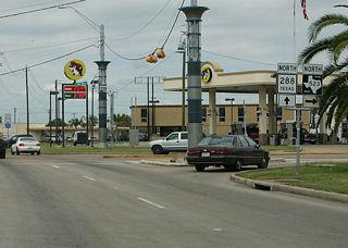 Texas 288 (Brazosport Boulevard) north at the north end of FM 523 (Gulf Boulevard). FM 523 meanders 25.8 miles northward from Oyster Creek to Bastrop Beach and a bypass routing of Angleton. The FM road meets Texas 288 near its north end.