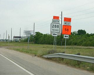 Temporary signage installed along Texas 288 north for Brazoria County Route 58 (Croix Road) during the conversion of the at-grade intersection into a diamond interchange.