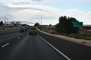 This distance sign stands ahead of Gould Wash eight miles east of a trumpet interchange with I-15 south to St. George and north to Cedar City.