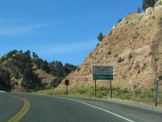 Since corrected, this distance sign incorrectly referenced Springdale at 28 miles, when SR 9 reaches the town in 25 miles. Located near the southwest corner of Utah along I-15, St. George is 65 miles away.
