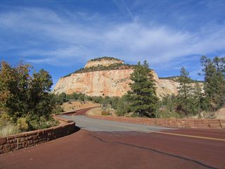 Upon entering Zion National Park, Utah 9 changes into the Zion-Mount Carmel Highway. Since the Utah Department of Transportation does not maintain the section of highway within the park, Utah 9 technically has a route break through the park. However, for continuity we'll continue to refer to the route as Utah 9. At least here the routing is the same at both ends of the park; it is much more complicated in Yellowstone National Park, with seven U.S. routes coming from various directions, and three of them not resuming on the other side. Utah 9, meanwhile, passes through a few sandstone rock formations before it reaches Zion Valley.