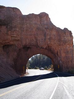 Utah 12 passes through two tunnels as part of the Red Canyon. Both tunnels are very short, and they cut through the red rock. Pull outs are available on either side of both tunnels to allow for picture taking and closer inspection. A bicycle and walking path is located adjacent to the highway on the south side, and that allows for safe walking between the two tunnels. The first picture shows the first tunnel along eastbound, and the second picture shows the second tunnel.