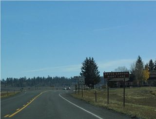 Utah 12 gains an exit-only lane to allow turning traffic to decelerate for the turn onto southbound Utah 63. The early-morning sun makes this photo a bit dark.