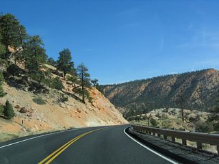 After passing the junction with Utah 63, Utah 12 begins a descent to the Paria River Valley. The towns of Tropic and Cannonville are located in this valley, and the highway has a few curves along the descent.
