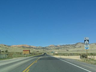 Upon leaving Cannonville, the cliffs on the hills above the highway suggest the kind of colors and rock formations to be seen in the area around Bryce Canyon. At this lower elevation, such rock formations do not exist.