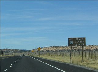 Upon reaching the top of the hill, Utah 12 approaches its junction with Utah 63 south and unsigned Garfield County Route 1660 north, one-quarter mile.