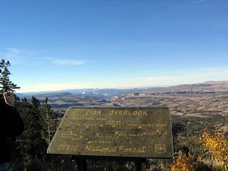 From this turnout on Utah 14 before reaching Midway Summit on Markagunt Plateau, Zion National Park, the Kolob Plateau and Canyons, and Black Mountain are visible, thus offering dramatic scenery.