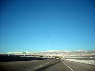 Utah 67 (Legacy Parkway) leaves Salt Lake County and enters Davis County.