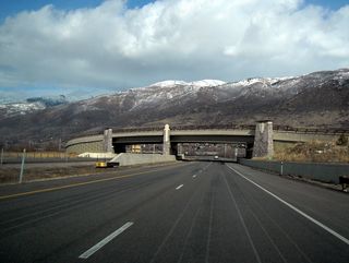 Leaving the Parrish Lane interchange, Utah 67 (Legacy Parkway) north passes under North 1250 West (no access). The mighty Wasatch Front comes into view as the parkway shifts toward the northeast ever so briefly. Ahead, Utah 67 will curve north again to parallel Interstate 15 closely for the next six miles.