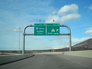 Northbound Utah 67 meets Exit 12, Utah 225 (Park Lane). Ahead, both lanes of the Legacy Parkway will default onto Interstate 15 north en route to Ogden and Pocatello.