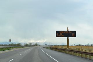 This variable message sign posted travel times to Interstate 80 and Utah 201 via Utah 67 (Legacy Parkway) south and Interstate 215 south.
