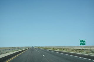 The sage brush and other vegetation gives way to salt flats west of the upcoming diamond interchange (Exit 41) with Old Highway 40.